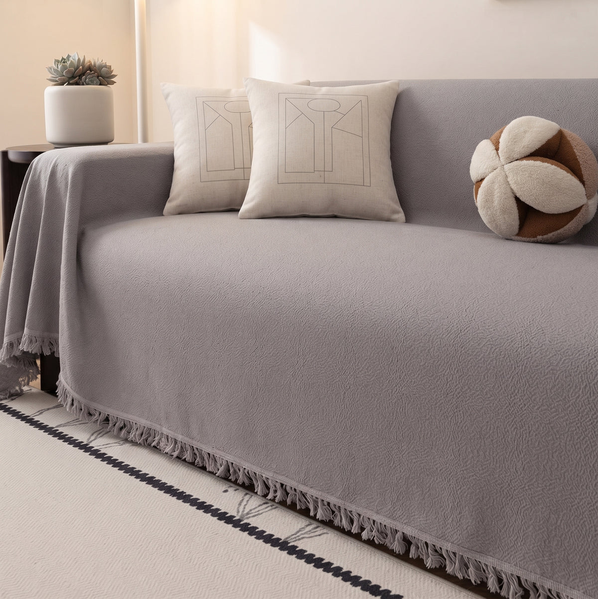 Velvet grey sofa throw, 180 x 300 cm, draped over a sofa