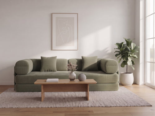 Olive green sofa bed in a living room, full view